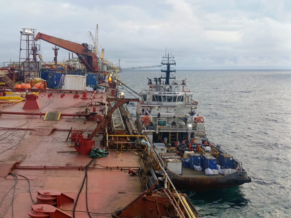 Offshore support vessel alongside a floating production facility