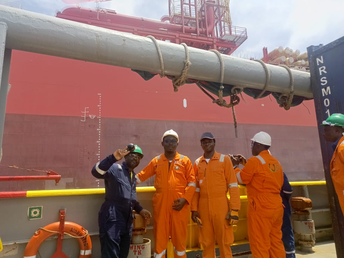 Kajomi Energy crew on deck alongside a vessel during offshore works